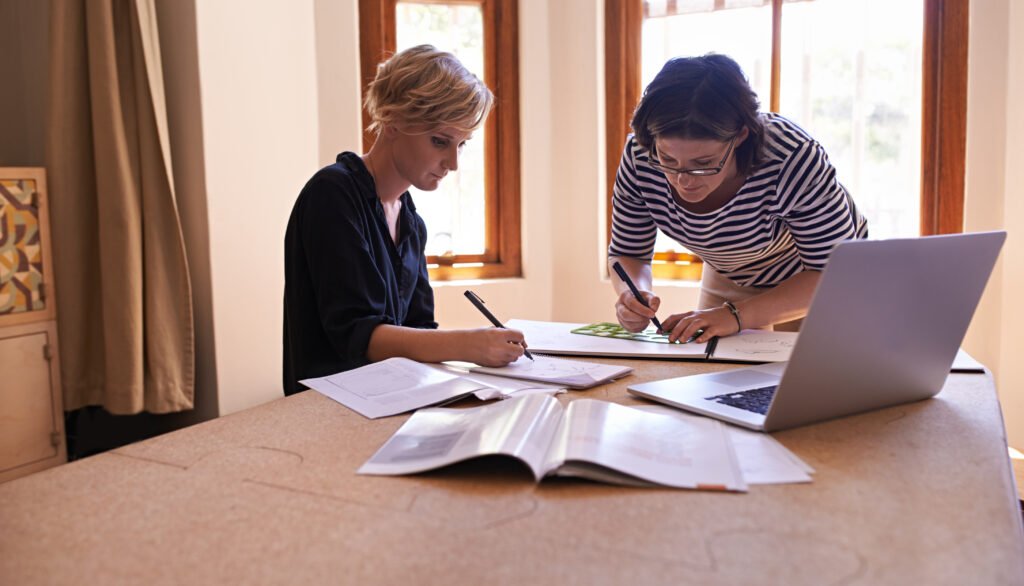 The current image has no alternative text. The file name is: business-women-designer-collaboration-with-remote-work-working-fashion-design-process-teamwork-entrepreneurship-drawing-idea-home-office-pattern-creation-startup-company-scaled.jpg